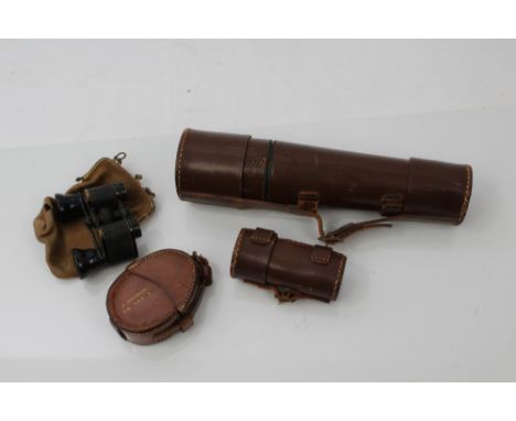 Prismatic compass in brown leather case, named on side 'R. Grierson R.M.  R.N.D.', together with a similar spotting scope and