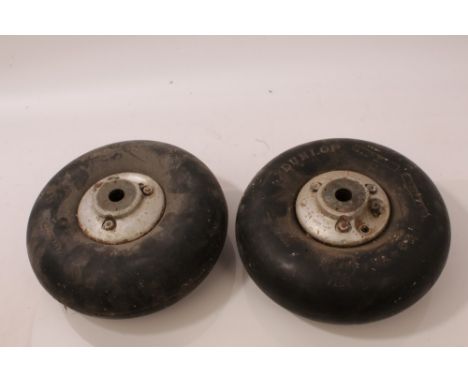 Two Second World War period aircraft tail wheels with tyres - one bearing Air Ministry mark, the other marked Dunlop