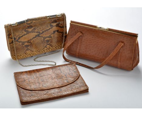 Vintage leather handbags, to include: a python handbag, a python clutch bag, and a crocodile effect handbag, 19 x 26cms. 7 1/