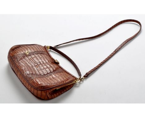 Christian Dior: a mid 20th Century crocodile leather handbag, with plated metal clasp and logo, detachable shoulder strap, 16