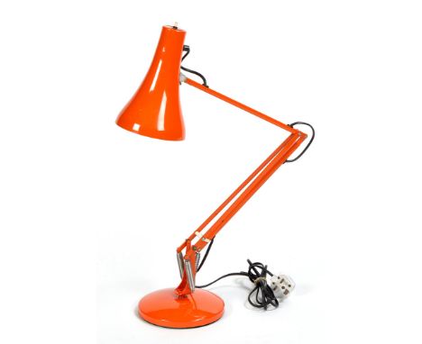 A bright orange coloured anglepoise lamp; together with a bright orange glass hanging light shade.