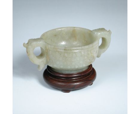A pale green jade censer with wooden stand, the rounded sides carved with bead bosses, the mythical beast handles with mask t