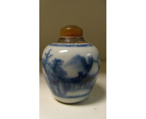 An 18th century blue and white miniature jar converted to a snuff bottle, painted with a continuous scene of islands, the lat