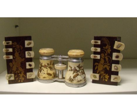 An '1894' pair of Shibayama worked opera glasses with two whist markers, the ivory barrels of the glasses decorated with cran