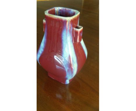 A flambe arrow vase, the corners of the rectangular sectioned body lavender streaked, the broader sides of the body moulded w