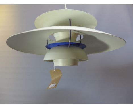 A contemporary cream and blue Danish Patron hanging light. 