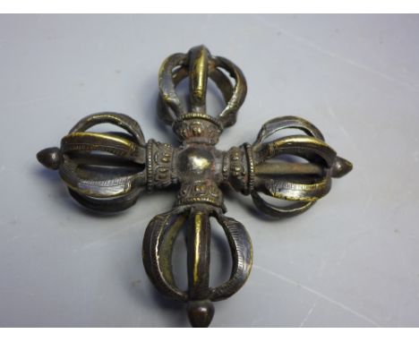 A large Tibetan bronze double dorje. 