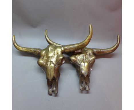 A pair of bronze buffalo skulls.