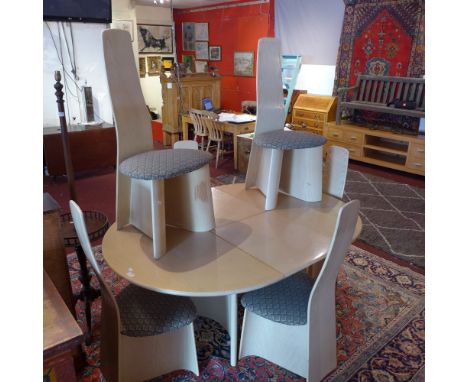 20th Century vintage light oak extending table and six chairs. The chairs having green paisley style upholstery. 159cm x 115c