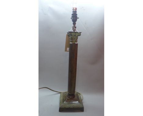 A bronzed Corinthium column table lamp.