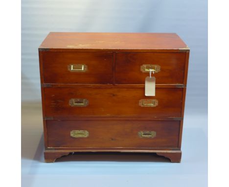 A Campaign yew wood chest of two short over two long drawers raised on carved bracket feet, H:76cm W:87cm D:45cm
