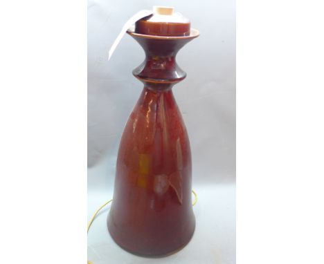 An Anthony Gilham Rohan pottery table lamp, glazed in deep red 