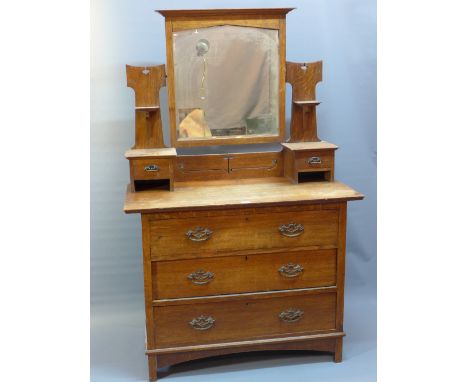 A 19th Century oak dressing chest with mirror superstructure above three drawers and raised on bracket feet. 