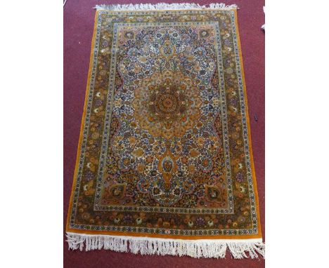 Indian carpet, honey tear drop medallion to centre over floral ground and border, 212x122cm