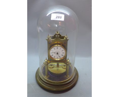 An early 20th Century brass skeleton clock under glass dome, H:30cm