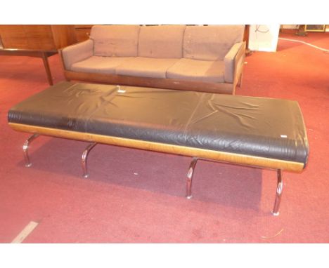 A Charles Eames style black leather bench raised on bent plywood and chrome legs. H-40cm W-183cm D-70cm