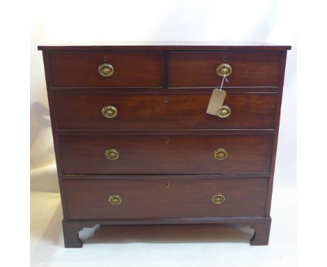 A Georgian mahogany chest of two short over three long drawers raised on carved bracket feet. H-102cm W-107cm D-55cm