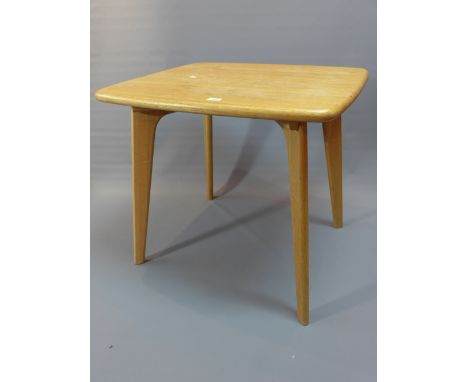 A contemporary light oak dining table, raised on four splayed legs. H-72cm, W-79cm, D-70cm 