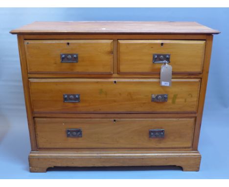 An Edwardian walnut dressing chest with mirror superstructure above two short over two long drawers and raised on carved brac
