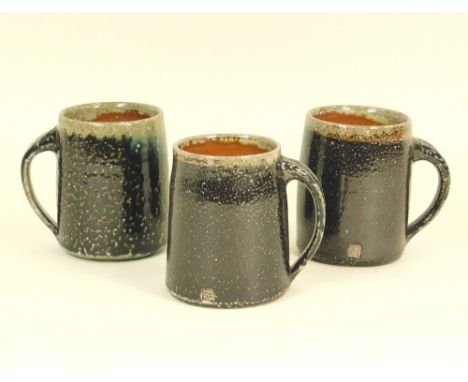 LEACH POTTERY Three half-pint mugs from the current Standard Ware range.