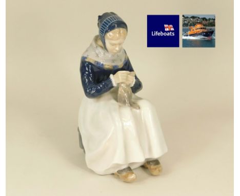 ROYAL COPENHAGEN. A Royal Copenhagen figure No.1317, Woman Knitting. (Sold on behalf of R.N.L.I Penlee)