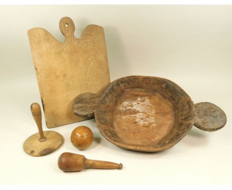 MISCELLANEOUS. A French oak breadboard, 44cm., a wooden carpet bowl etc.