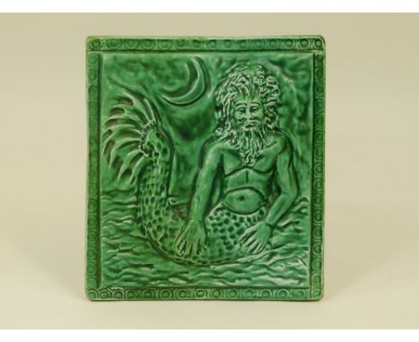 GLAZED PLAQUE. A moulded ceramic merman plaque. 19 x 21cm.