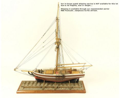 SHIP MODEL. A single masted ship model. Length 44cm.