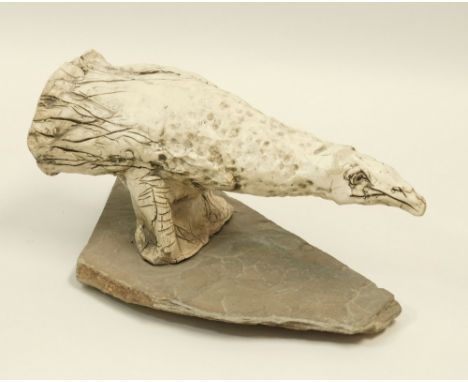 JULIAN DYSON. A ceramic bird sculpture, signed on slate base. Also signed &amp; dated 11/00. Max. height 18cm. Max. length 33