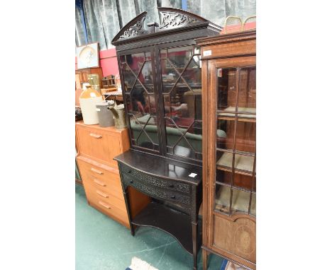 An early 19th century astragal glazed bookcase on stand in the Chippendale taste