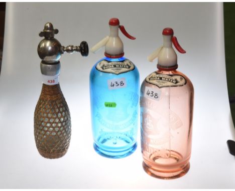 Two Vintage soda syphons, the coloured glass bottles etched J. Alexander & Sons, Avenue Works, Kendal, and with paper labels 
