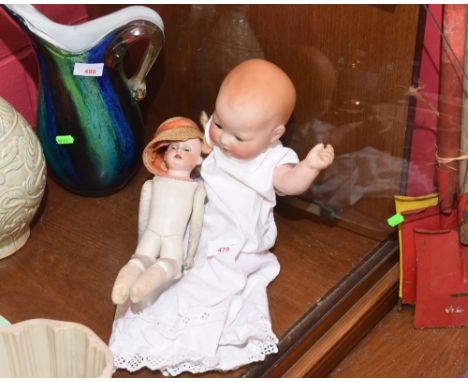 An Armand Marseille bisque headed baby doll no. 351 together with an Armand Marseille 370 doll with kid leather body and join