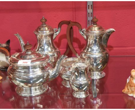 A silver plated five piece tea and coffee service, with turned wood finials and handles, 