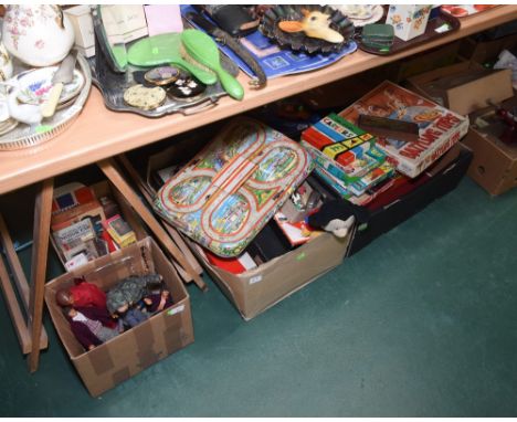 Four boxes of vintage games inc. a tin plate Technofix car track, Action Man etc