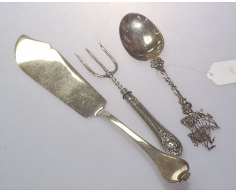 A silver fish server, London 1917 together with Victorian silver handled three prong fork, London 1866 together with a silver