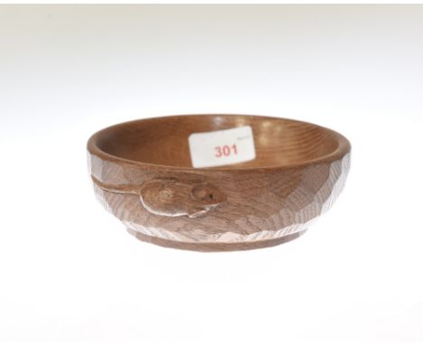 A Robert Mouseman Thompson oak nut bowl, adzed and with carved mouse signature. Diameter 15cm