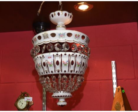 A ruby and white flash glass lustre three drop ceiling light painted with floral sprays