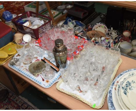 Three trays of cut and pressed glass drinking glasses inc. Webb, a vintage cocktail shaker etc