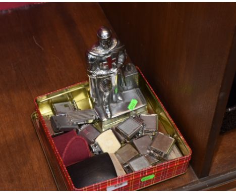 A novelty table lighter in the form of a Knight together with collection of  chrome and metal handheld lighters including mak