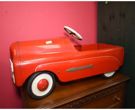A vintage painted Triang pedal car