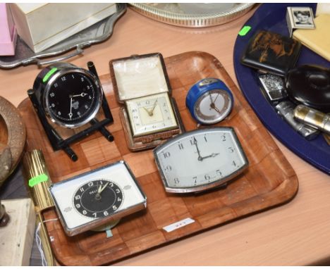 A tray of vintage clocks inc. a Smiths dashboard clock, a faux snakeskin cased Smiths travelling clock etc