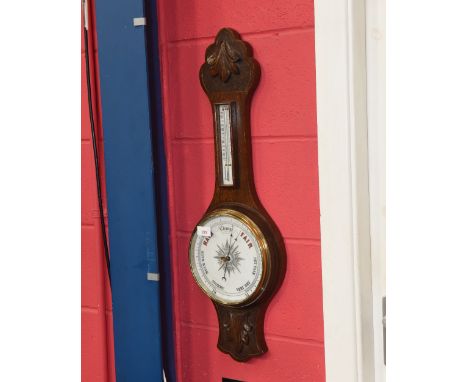 An oak cased barometer