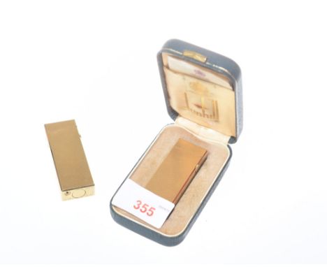 A gilt metal Dunhill rollagas lighter with engine turned decoration in case together with another similar, both US Patent No.