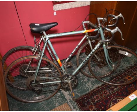 Two vintage road bikes, a Peugot and a Viking