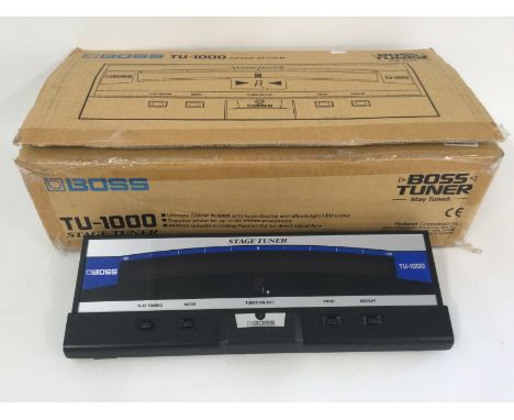 A boxed and as new Boss TU-1000 stage tuner pedal with power lead and manual.