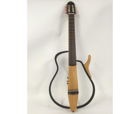 A Yamaha silent guitar, model SLG-100N with original soft case.