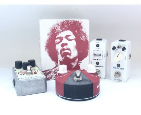 Four guitar pedals including an Electro Harmonix Soul Food overdrive boost, a boxed Dunlop Band Of Gypsys Fuzz Face mini dist