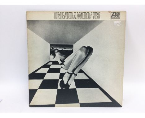 A first UK pressing of the 'Time And A Word' LP by Yes, 2400006 on red/plum Atlantic labels. Some hairline marks to vinyl but