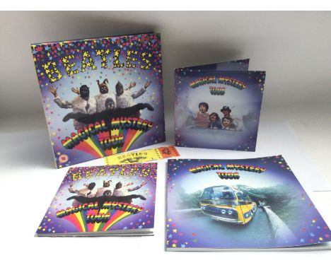 A Beatles deluxe box set of 'Magical Mystery Tour' comprising a two disc EP , a blu ray and a DVD of the film plus book and t