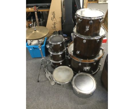 A Trak drumkit with various cymbals including a Zildjan Oriental crash, cases and stands. Also includes a tambourine and cowb